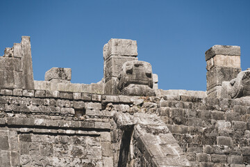 Large snake head sculptures at Chichen Itza Archaeological Zone.