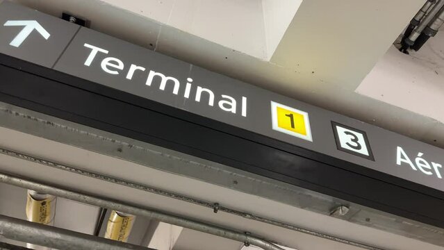 Terminal 1 sign with arrow in parking garage at Toronto Pearson YYZ airport