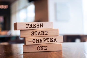 Wooden blocks with words 'Fresh Start Chapter One'.