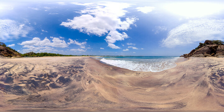 Sandy beach and blue ocean waves. Elephant Rock, Arugam Bay, Sri Lanka. 360 panorama VR.