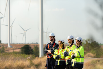 Portrait of engineer stationed at the Natural Energy Wind Turbine site. with daily audit tasks of major wind turbine operations that transform wind energy into electrical electricity
