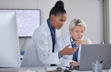 Teamwork, laptop and doctors planning in laboratory for medical research for science. Cooperation, collaboration and researchers, black woman and senior female helping, discussion or brainstorming.