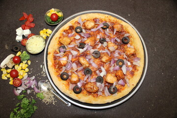 Indian Pizza with chicken, olives, onion etc.