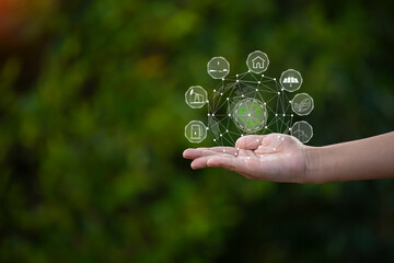 Technology, hand holding with environment Icons over the Network connection on green background.