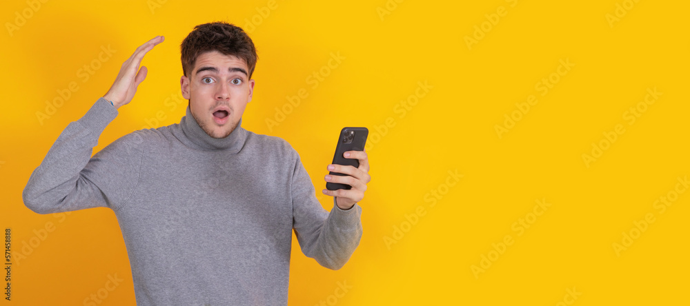 Wall mural isolated young man with mobile phone