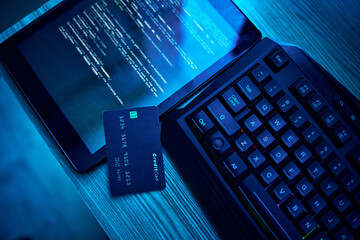 Information technology, hacking and credit card for cyber security crime, phishing and software on digital tablet. Html script, screen and fintech of data fraud, password and coding on dark neon desk