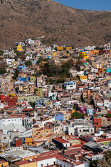 Very beautiful view of the city at sunset in the Mexican city of Guanajuato surrounded by large mountains.