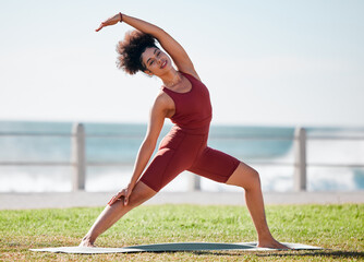 Fitness, stretching and black woman for yoga on grass for healthy lifestyle, body wellness and...