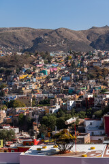 Very beautiful view of the city at sunset in the Mexican city of Guanajuato surrounded by large mountains.