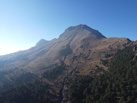 a drone photo view shot in the high lands of a volcano, the malinche in tlaxcala and puebla landscape with mountains spring landscape