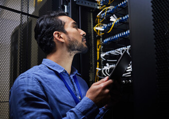 Tablet database, server room and engineer man looking at connection cables for maintenance or software update at night. Cybersecurity wire, it programmer and male with tech for data center networking