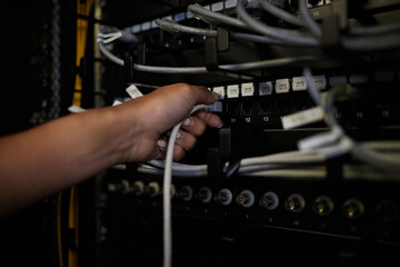 Engineer hands, server room and connection cable for maintenance or software update at night....