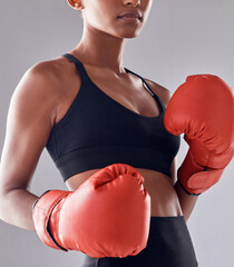 Boxing, fitness gloves and woman in studio for sports exercise, strong muscle or mma training....