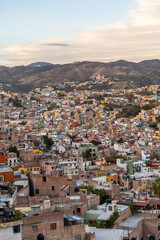 Very beautiful view of the city at sunset in the Mexican city of Guanajuato surrounded by large mountains.