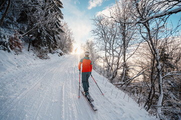 Mountaineer backcountry ski walking ski alpinist in the mountains. Ski touring in alpine landscape...
