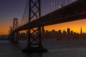 Fototapeta na wymiar The Bay Bridge and San Francisco Waterfront during the Blue Hour