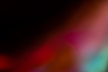Blur colorful rainbow crystal light leaks on black background. Defocused abstract multicolored retro film lens flare bokeh analog photo overlay or screen filter effect. Glow Vintage prism colors