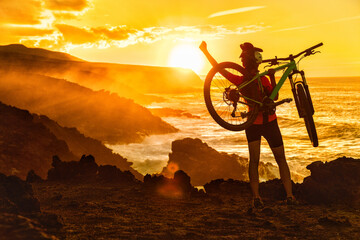 Success, achievement, accomplishment and winning concept with cyclist mountain biking. Happy MTB...