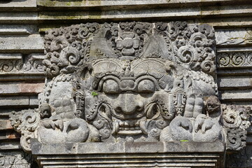The relief of kala kirtimukha on penataran temple. Kala kīrttimukha is the name of a swallowing fierce monster face with huge fangs and a gaping mouth