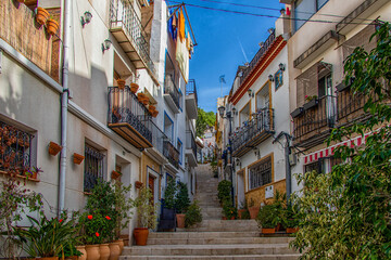 Fototapeta na wymiar l historic old colorful houses Barrio Santa Cruz Alicante Spain on a sunny day