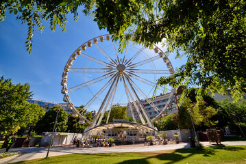 Budapest Eye (ferris wheel) at Erzsebet Square. Luminous Ferris wheel in city. 