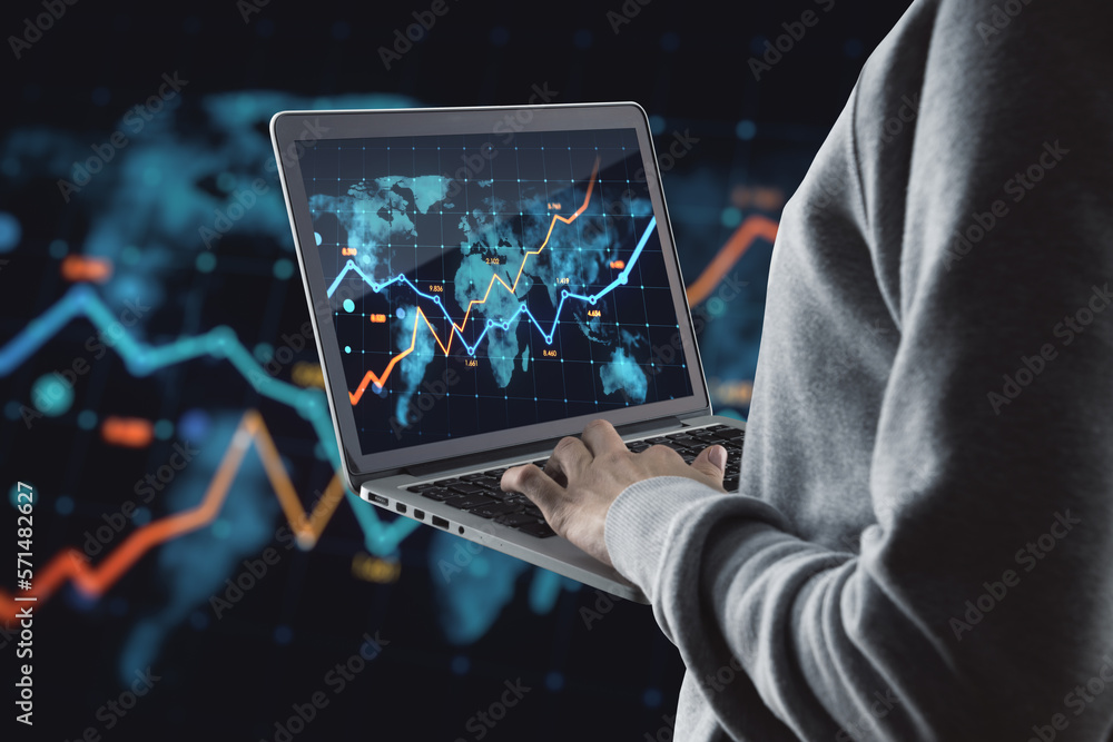 Poster close up of hands using laptop with glowing business chart and map on dark background. stock, global