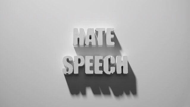 the words HATE SPEECH appearing letter by letter on white background with shadows, one of a series of concrete letters
