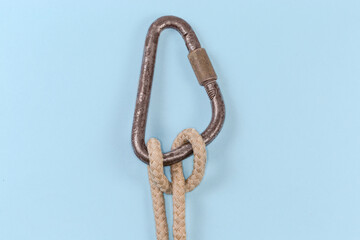 Rope knot Munter hitch on a blue background