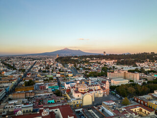 Fototapeta na wymiar Beautiful aerial view of the city of Puebla in Mexico. Amazing sunset.
