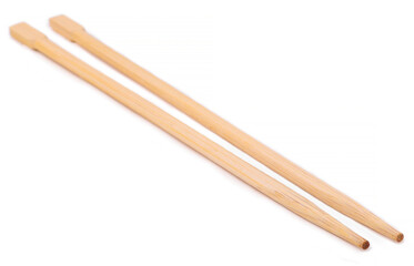 Wooden chopsticks, white background, close up