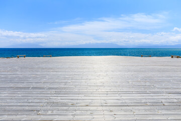 Empty wooden square with clear lake natural background in Xinjiang, China.