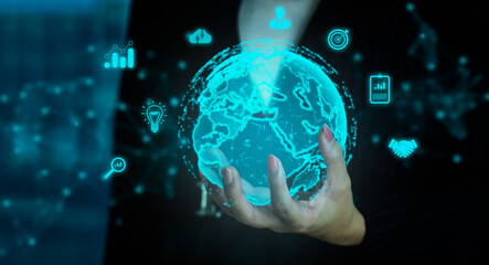 Business and Technology concept. Businesswoman hand holding on virtual digital world control and connecting on blurred building background.