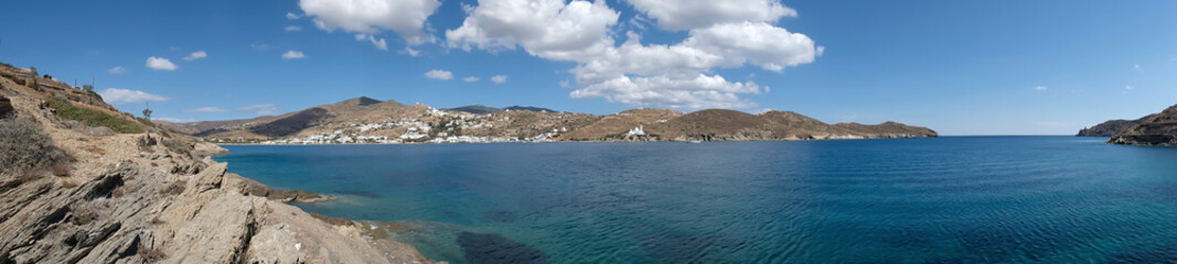Panoramic view of the beautiful beach of Tzamaria in Ios Greece and the whitewashed village in