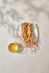 Honey and ginseng are placed on a bowl. natural light.