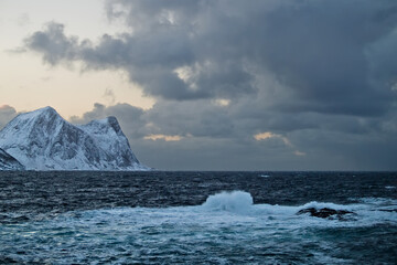 Stormy weather in Northern Norway - waves crashing over island