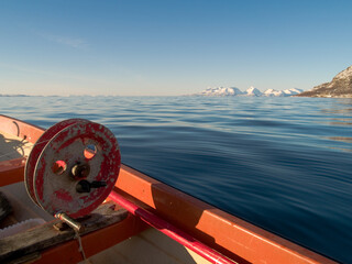 Old fishing wheel on the sea in Northern Norway