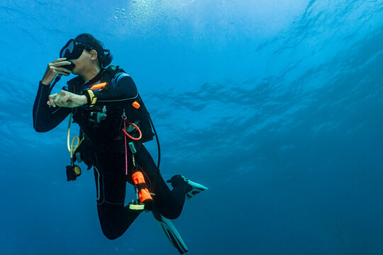 female diver performing a safety stop in 5meters depth in Australia