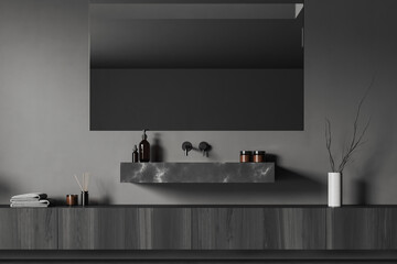 Front close up view on dark bathroom interior with mirror