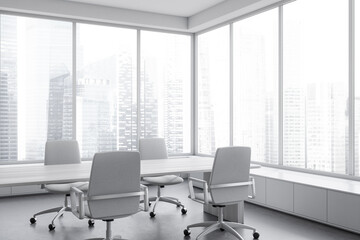 Corner view on bright office room interior with conference board