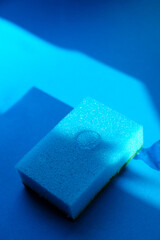 blue dish sponge and blue background