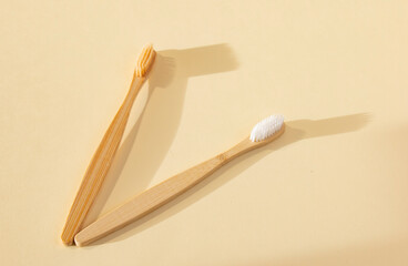 Bamboo toothbrushes on a gentle background. Biodegradable Natural Bamboo Toothbrush