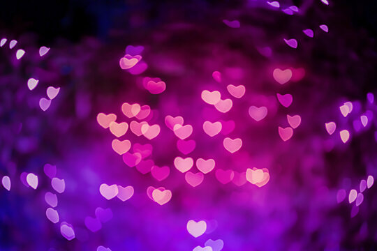 Abstract images of beautiful fresh pink and purple colored soft and swirl heart bokeh from ornamental lights flickering in the garden. Blurry background for Autumn season, Valentine or Love concept.