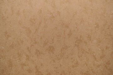 The wallpaper in tan and brown design