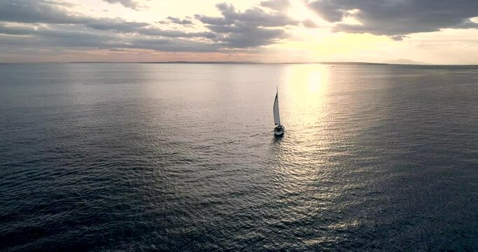 Aerial video with sailboat drone in the Mediterranean at sunset_Spain