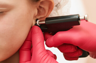 little girl during an ear piercing