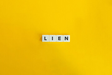 Lien (Security Interest) Word on Block Letter Tiles on Yellow Background. Minimal Aesthetics.