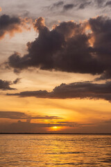 Obraz premium Beautiful view to orange sunset clouds and river in the Amazon Forest