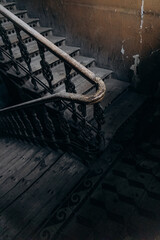 wooden railings in an old dark entrance