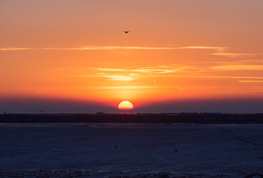 Late sunset with clouds above the coast