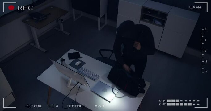 Thief Stealing Computer From Office